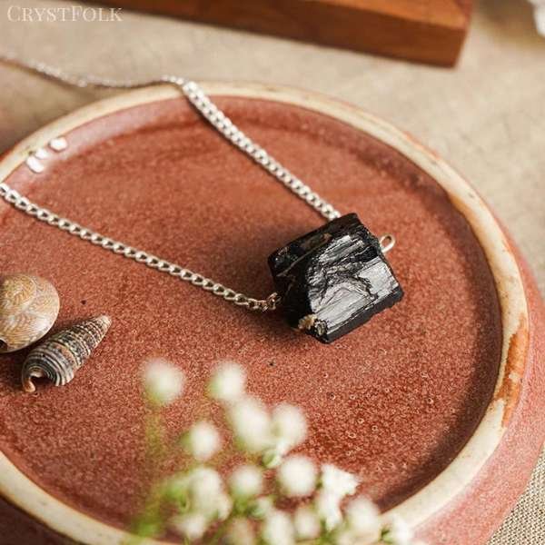 black crystal necklace meaning